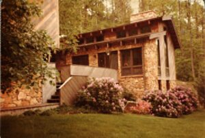 A house with flowers in front of it.