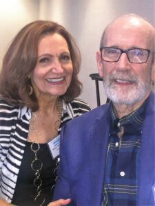 A man and woman posing for the camera.