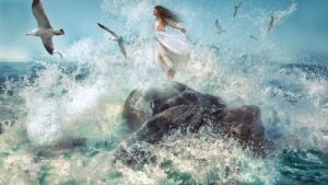 A woman in white dress jumping off rocks into the ocean.